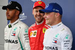 Foto zur News: Lewis Hamilton (Mercedes), Sebastian Vettel (Ferrari) und Valtteri Bottas (Mercedes)