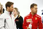 Foto zur News: Romain Grosjean (Haas) und Sebastian Vettel (Ferrari)