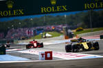 Foto zur News: Carlos Sainz (Renault) und Sebastian Vettel (Ferrari)