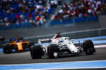 Foto zur News: Marcus Ericsson (Sauber) und Fernando Alonso (McLaren)