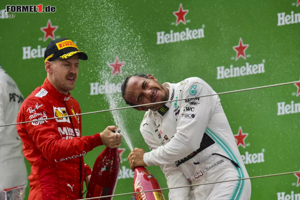 Foto zur News: Sebastian Vettel (Ferrari) und Lewis Hamilton (Mercedes)