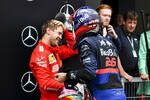 Foto zur News: Sebastian Vettel (Ferrari) und Daniil Kwjat (Toro Rosso)