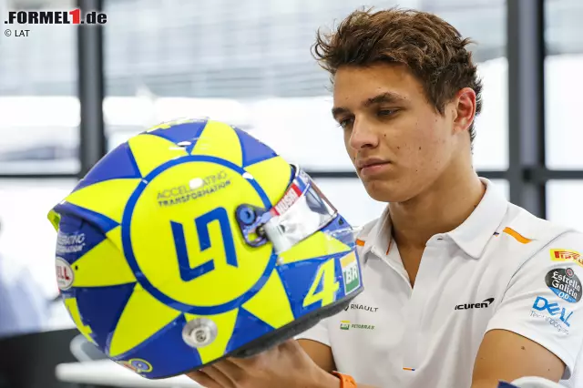 Foto zur News: McLaren-Rookie Lando Norris nutzt die Chance beim Grand Prix von Italien in Monza 2019: Er widmet sein Helmdesign seinem "Idol" Valentino Rossi. Besonders markant für dessen Design ist die neongelbe Sonne, die die MotoGP-Legende auch auf dem eigenen Helm trägt. Eine nette Geste, doch diese Idee hatten schon andere Piloten vor ihm ...