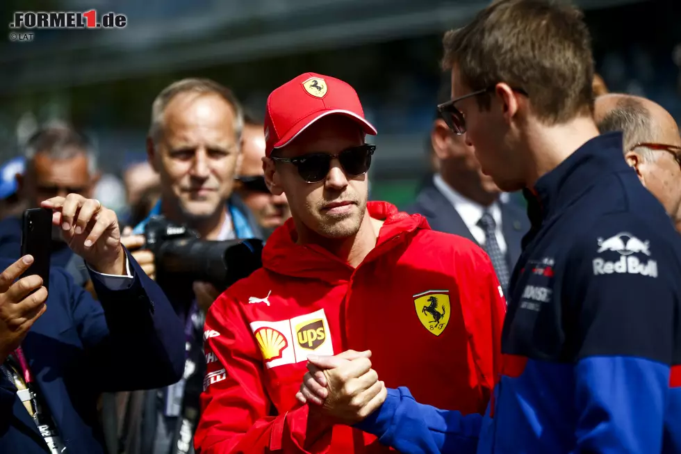 Foto zur News: Sebastian Vettel (Ferrari) und Daniil Kwjat (Toro Rosso)