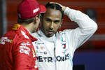 Foto zur News: Sebastian Vettel (Ferrari) und Lewis Hamilton (Mercedes)