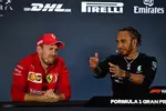 Foto zur News: Sebastian Vettel (Ferrari) und Lewis Hamilton (Mercedes)