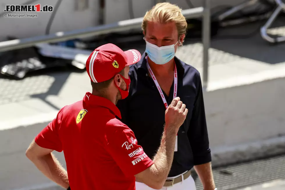 Foto zur News: Sebastian Vettel (Ferrari) und Nico Rosberg