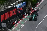 Foto zur News: Charles Leclerc (Ferrari) und Lance Stroll (Aston Martin)