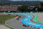Foto zur News: Liam Lawson (Racing Bulls), Lando Norris (McLaren) und Esteban Ocon (Haas)