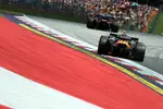Foto zur News: Lewis Hamilton (Ferrari) und Lando Norris (McLaren)