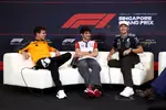 Foto zur News: Lando Norris (McLaren), Esteban Ocon (Haas) und George Russell (Mercedes)
