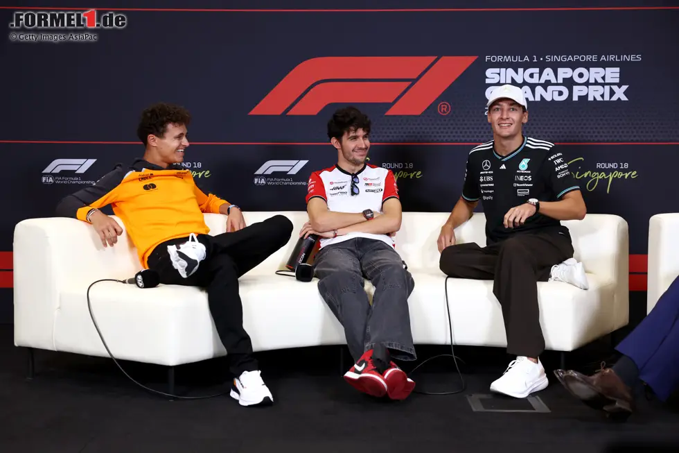 Foto zur News: Lando Norris (McLaren), Esteban Ocon (Haas) und George Russell (Mercedes)