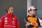 Foto zur News: Lewis Hamilton (Ferrari) und Lando Norris (McLaren)