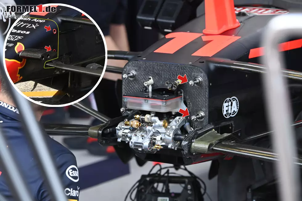 Ein Blick auf das Chassis und die Nase des RB18 zeigt, wie die beiden miteinander zusammenarbeiten. Die Stifte am Chassis halten die Nase, und die nockenartigen Einstellvorrichtungen können von der Seite aus festgezogen werden (rote Pfeile). Foto zur News: Ein Blick auf das Chassis und die Nase des RB18 zeigt, wie die beiden miteinander zusammenarbeiten. Die Stifte am Chassis halten die Nase, und die nockenartigen Einstellvorrichtungen können von der Seite aus festgezogen werden (rote Pfeile).