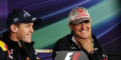 Foto zur News: Sebastian Vettel und Michael Schumacher