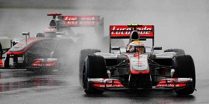 Foto zur News: Lewis Hamilton, Jenson Button