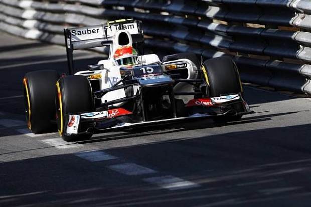 Foto zur News: Regen am Donnerstag: Button vor Grosjean