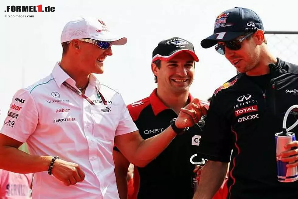 Foto zur News: Michael Schumacher, Timo Glock, Sebastian Vettel