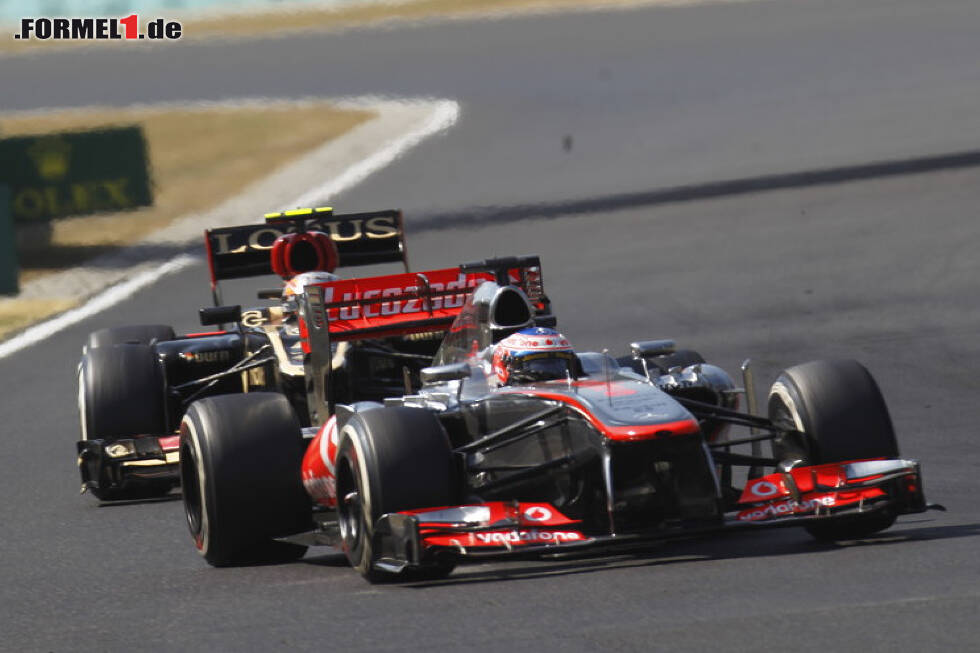Foto zur News: Jenson Button, Romain Grosjean