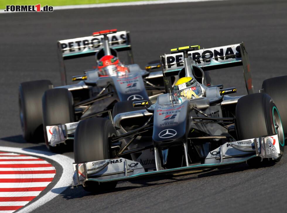 Foto zur News: Nico Rosberg, Michael Schumacher