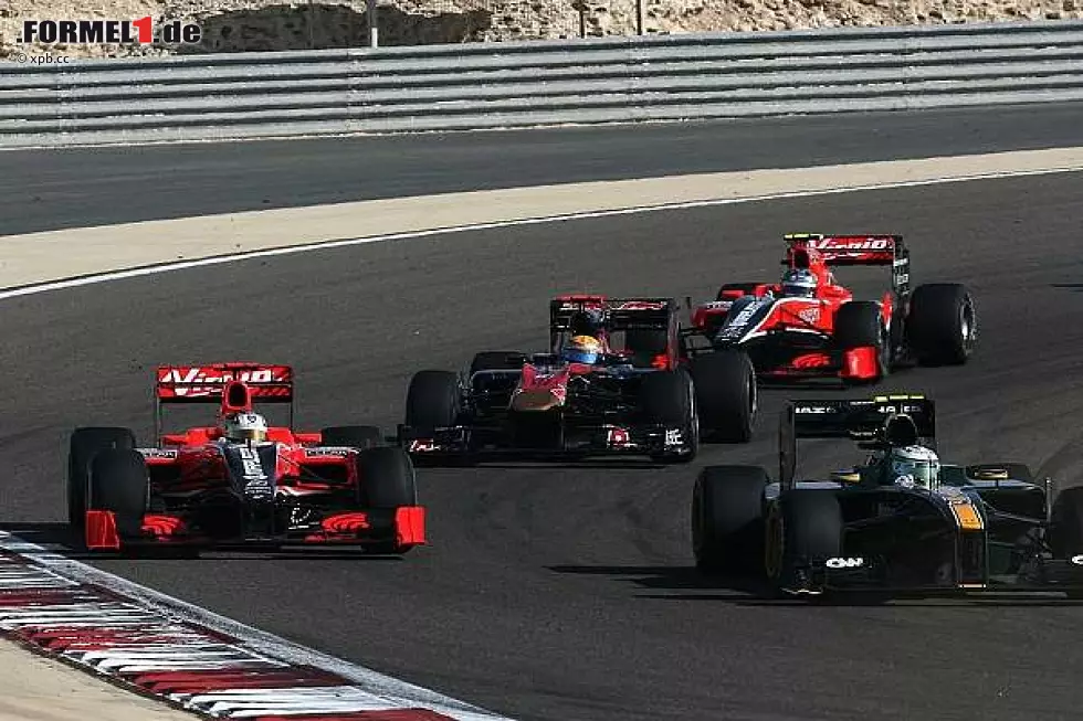 Foto zur News: Timo Glock, Heikki Kovalainen