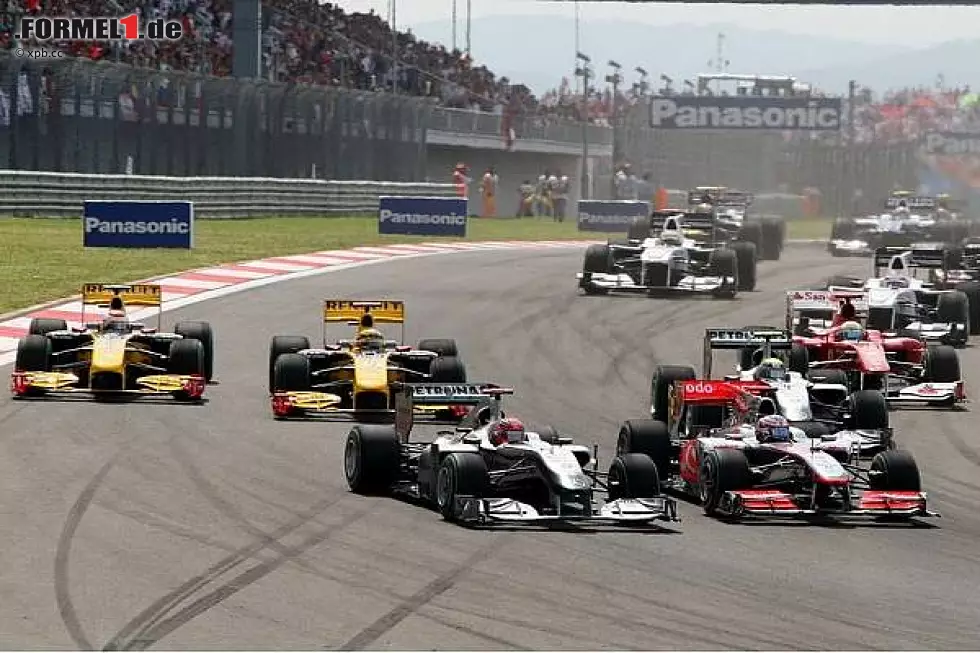 Foto zur News: Michael Schumacher, Jenson Button