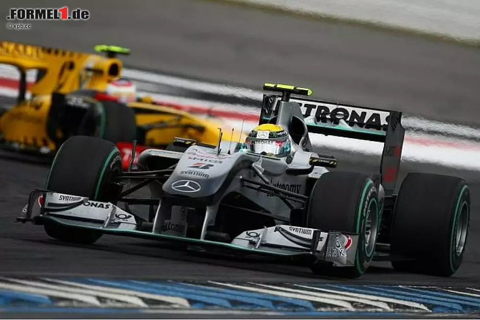 Foto zur News: Nico Rosberg, Vitaly Petrov