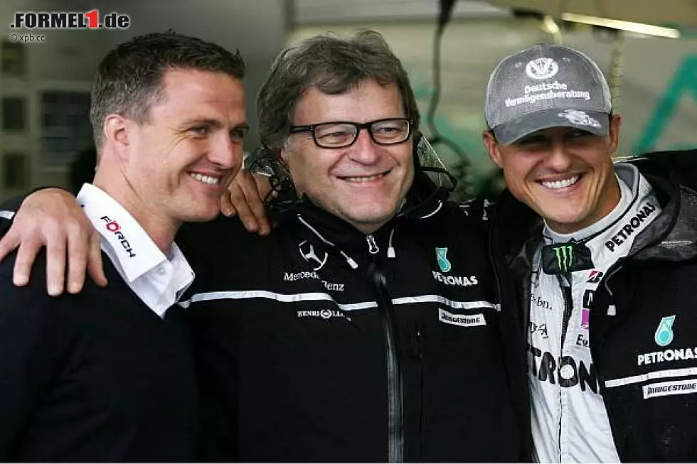 Foto zur News: Ralf Schumacher, Norbert Haug und Michael Schumacher