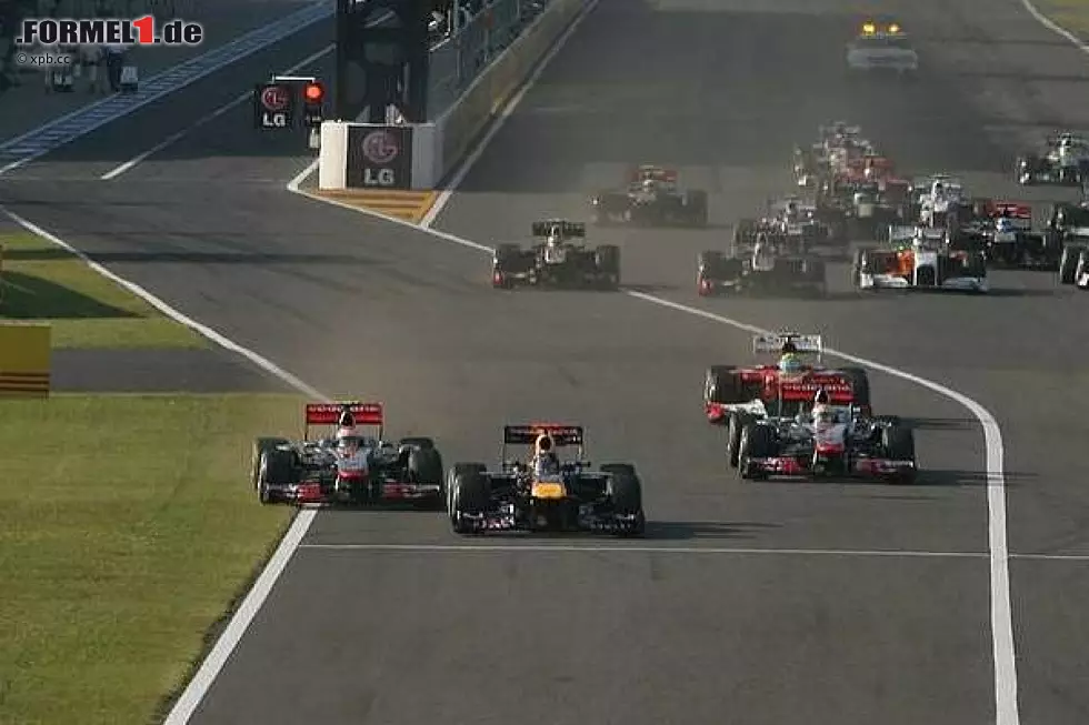 Foto zur News: Jenson Button neben Sebastian Vettel